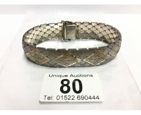 A fine mesh link bracelet inlaid with gold and silver, circa 1950's