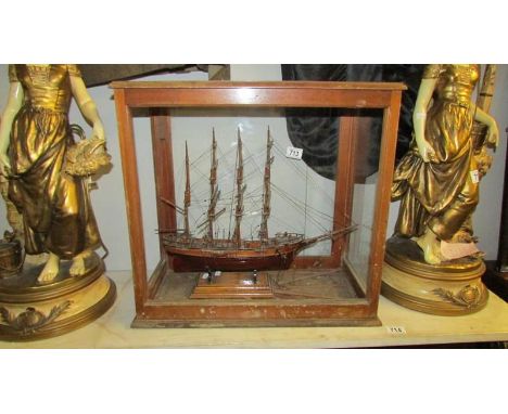 A cased antique model of a tall ship in glass case (missing front glass)