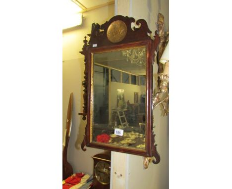 An early/mid 19th century mirror with wood surround and inset