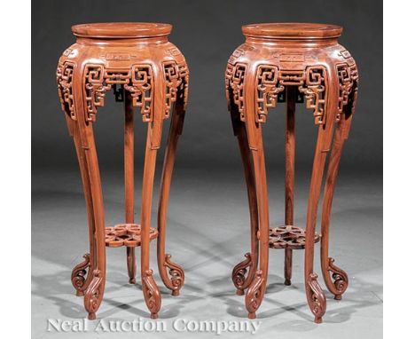 Pair of Chinese Hardwood Plant Stands, waisted circular tops, reticulated bombe skirt, tall scroll legs, pierced medial shelf