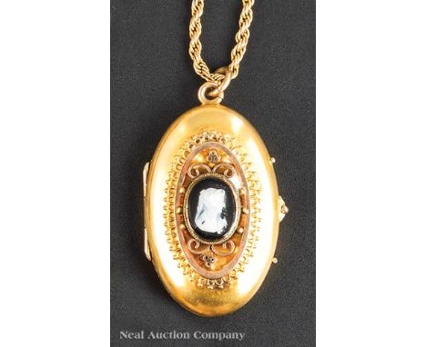 Antique American Yellow Gold Locket with Black and White Carved Stone Cameo, gold tested 10 kt., on gold-filled chain (tested