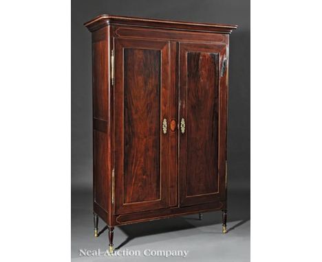 Important Louisiana Inlaid Mahogany Armoire, early 19th c., inlaid flared cornice and cartouche frieze, paneled doors centere