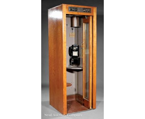 Vintage American Oak Telephone Booth, 20th c., with Automatic Electric Company rotary dial pay phone, accordion door, ventila