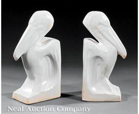 Pair Shearwater Pottery Pelican Bookends, 20th c., white enamel glaze, h. 10 1/2 in., w. 4 1/4 in., d. 5 1/4 in. (2 pcs.)    