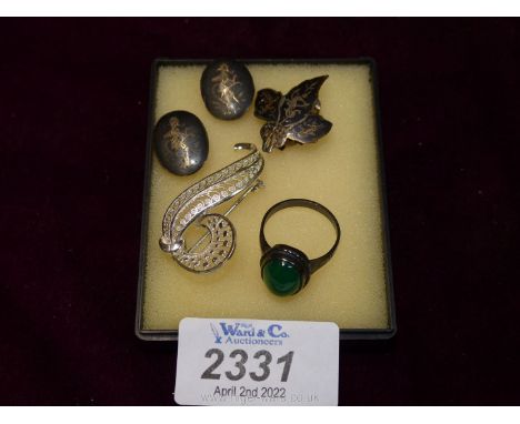 A small quantity of silver clip on earrings, ring with green stone and silver brooch.