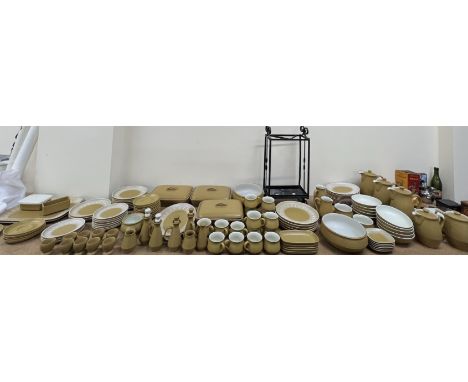 An extensive Denby stoneware part tea and dinner service  including cups and saucers, egg cups vinegar jars, jugs, basins, ch