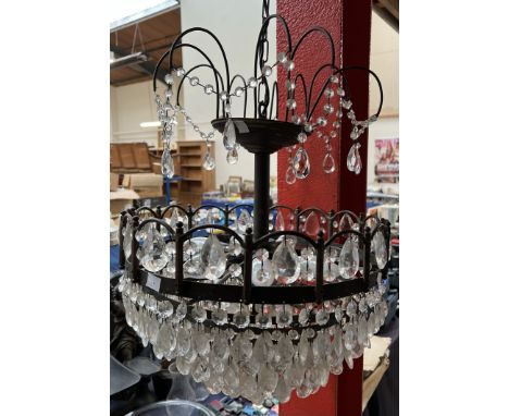 A crystal light fitting with five tiers of lustre drops and a painted chandelier 