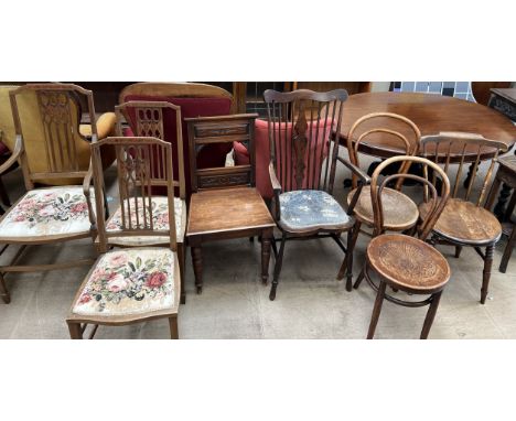 A set of three Edwardian mahogany salon chairs together with a hall chair, a stick back elbow chair, two bentwood chairs and 