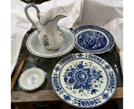 A Delft Arts jug and basin together with two chargers etc 