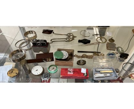 Bangles together with watch movements, pocket sundial, compass, miniature lords prayer etc