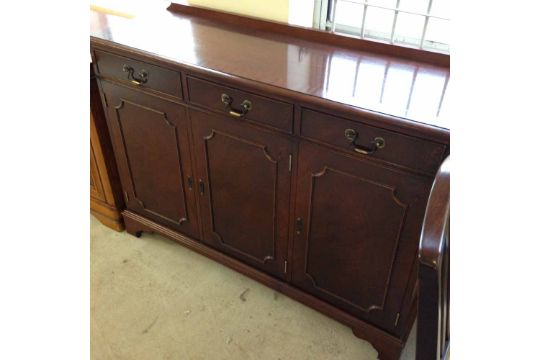 A Multiyork mahogany sideboard - 3 doors with drawers above. A Multiyork mahogany sideboard - 3 doors with drawers above.
