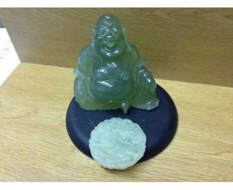 Jadeite oriental buddah 8cm tall together with a jade disc/pendant with carved dragon.  