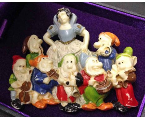 Rare Disney bakelite Snow White & Seven Dwarfs brooch c1937. Dwarfs featured as a band playing musical instruments.  