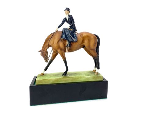 ROYAL WORCESTER FIGURE OF A LADY ON HORSEBACK, 'At the Meet', no.3114 by Doris Lindner, with a wooden base, 23cm high