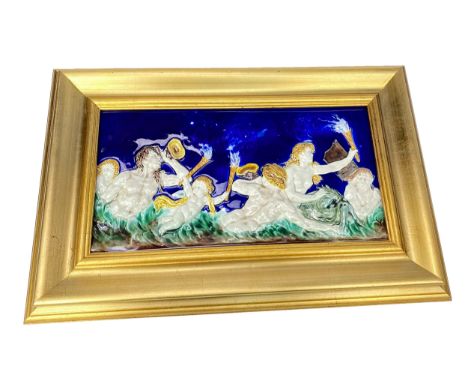 LATE 19TH CENTURY MAJOLICA TILE, depicting a procession of classical figures half submerged within water blowing horns and ho