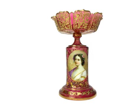 LATE 19TH CENTURY BOHEMIAN GLASS CENTREPIECE, the circular bowl with scalloped rim, gilded and jewelled, above a gilded pedes