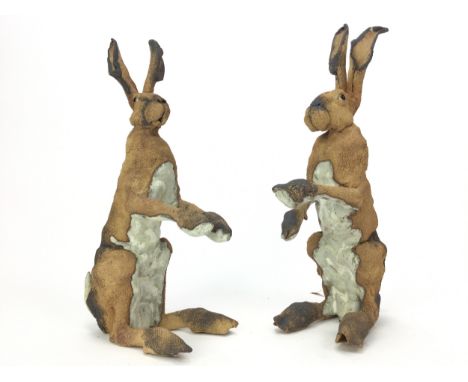 TWO HARES, A PAIR OF CERAMIC SCULPTURES BY ELAINE PETO, both modelled on hind quarters, monogrammed towards tale, the tallest