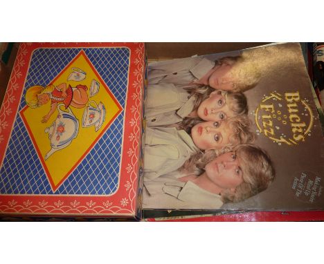 Child's ceramic tea set in original box and a small selection of records