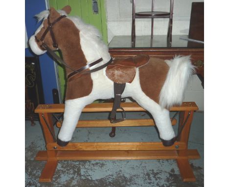 Plush rocking horse on wooden frame