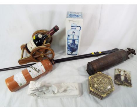 A good mixed lot to include a Courvoisier cognac bottle with stand in the form of a cannon, a vintage fire extinguisher by Pu