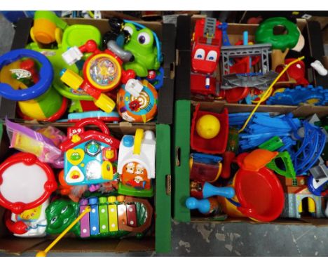 A mixed lot to include battery operated children's educational toys, a Thomas the Tank Engine rail track with trains, childre