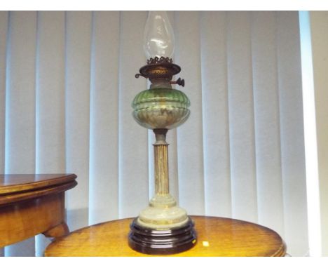 A brass oil lamp with a glass crimped body, approx 69cm (h)