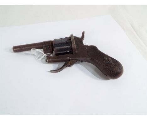 A 7mm pinfire 6 shot pocket revolver with folding trigger and checkered pistol grip ca 1850, Est £80 - £100This item is exemp