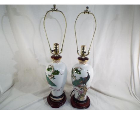 A pair of ceramic lamps decorated with depictions of peacocks, approx 65 cm (h) (2)