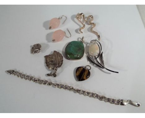 A collection of jewellery items to include predominantly silver examples to include opal brooch, turquoise pendant, rose quar