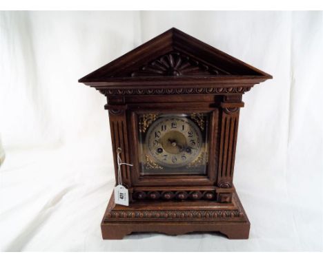 An oak cased Junghans bracket clock with striking gong, Arabic numerals on a silvered chapter ring - Est £40 - £50