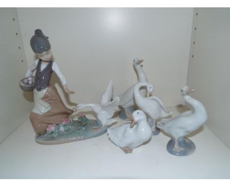 Lladro - five figurines comprising a depiction of a girl holding a basket of eggs pursued by goose in flight, 22 cm (high) an