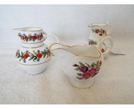 Royal Worcester - three small jugs decorated in a floral pattern comprising a Lamprey Cream Jug, a Silver Shape Jug and a Pop