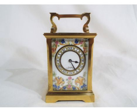 A 20th century, 8-day, timepiece carriage clock, the lacquered brass Anglaise case with glazed and bevelled panels and openin