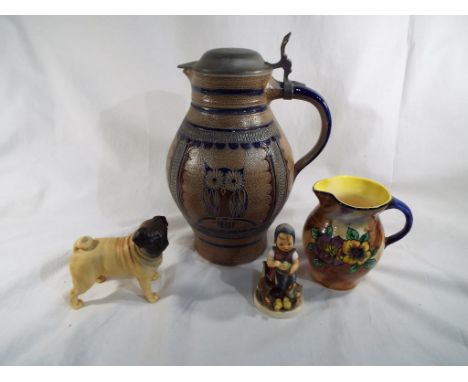 A mixed lot of ceramics to include a West German Jug with lid, a water jug, a Beswick Pug 'Cutmil Cutie' in a matt finish mod