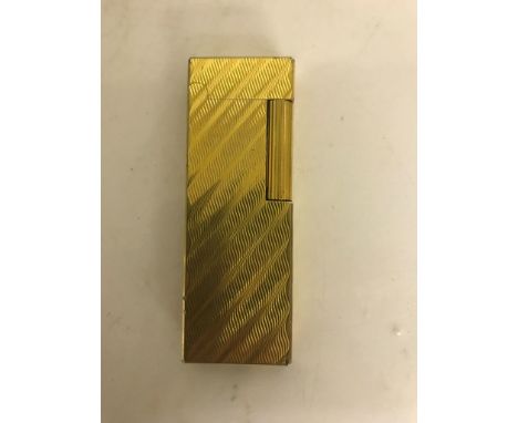 A gold-plated slim Dunhill lighter