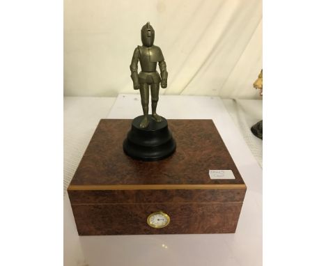 A Burr maple humidor; together with a musical lighter in the form of a knight in armour