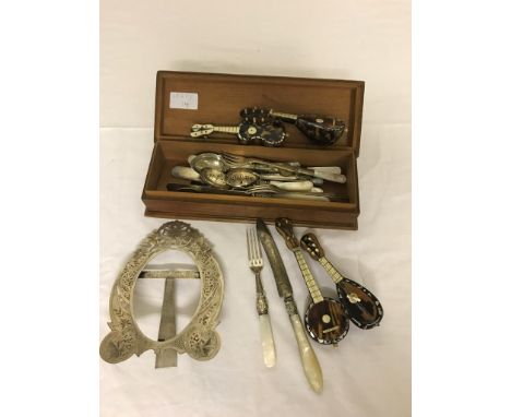 A quantity of EPNS and silver flatware, white metal picture frame and tortoiseshell instruments