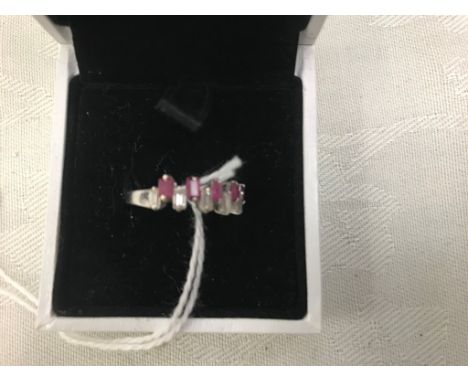 An 18ct baguette diamond and ruby dress ring