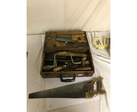 A box of vintage tools: planes, drill saws etc