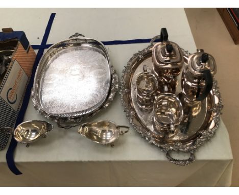EPNS twin-handled trays; together with a pair of sauceboats and a four-piece tea service