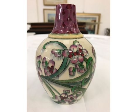 A vase by Wileman & Co Intarsio-Foley decorated with pink flowers on a white ground, printed Intarsio mark to base, No 3416