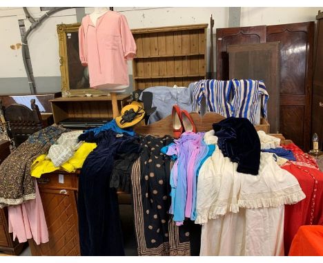 A collection of vintage clothing to include an Adidas jacket, various ladies dresses, top and other items 