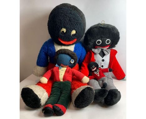 A large vintage golly soft toy, 79cm long, together with three other smaller