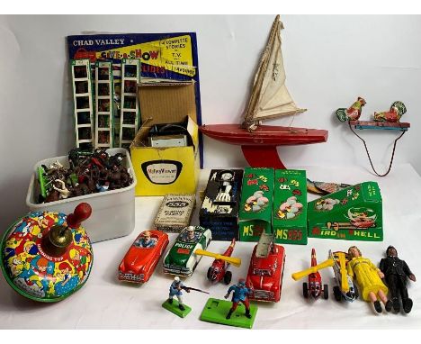 A collection of vintage toys including tin plate spinning top, Chad Valley slides and other items 