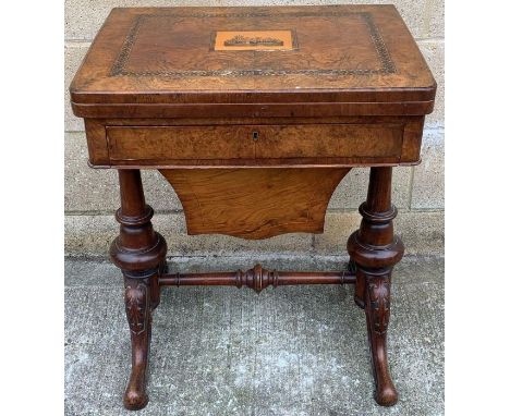 An early Victorian Tunbridgeware rosewood games table, enclosing a rosewood and satinwood inlaid backgammon, cribbage and dra