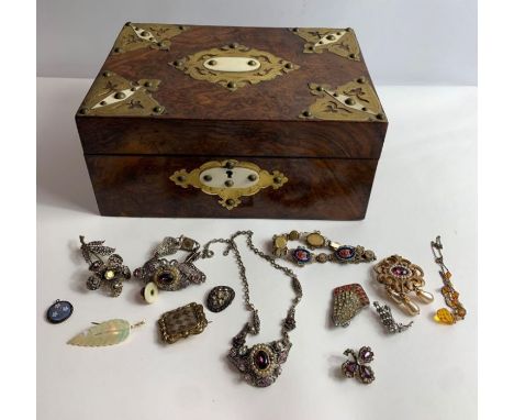 A late 19th/early 20th century veneered jewellery box, with applied brass and bone decoration, the single hinged lid opening 