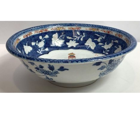 An 18th century Chinese export basin, on a blue ground decorated with various figures and children playing, with chicken skin
