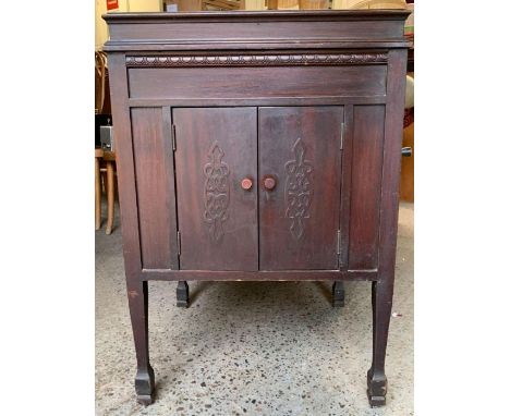 A vintage record player and records, standing on mahogany base 