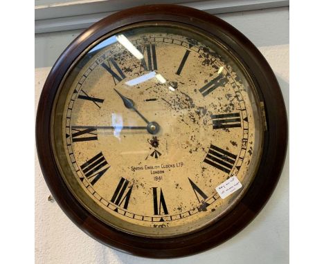 A genuine WWII 8 day military wall clock in a mahogany case, dial inscribed "Smiths English Clocks Ltd" London 1941 (with bro