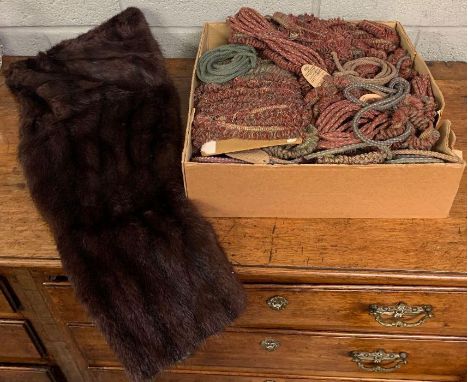 A vintage fur jacket, along with various textile fabric ties 
